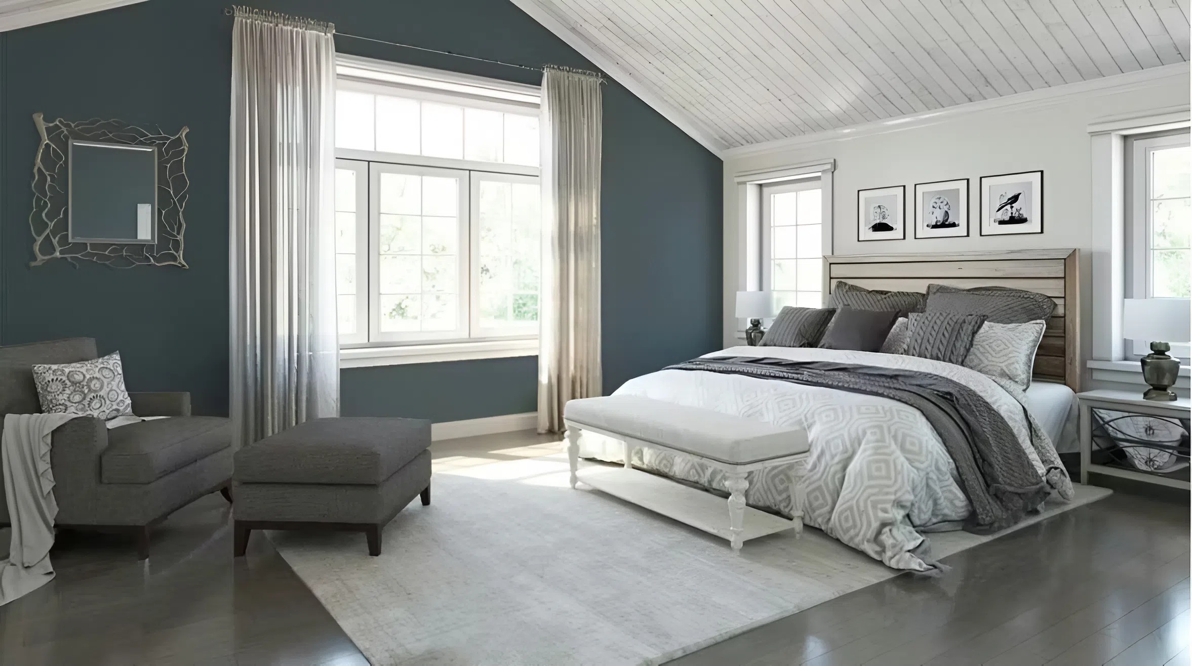 Bedroom with blue-gray accent walls and clean white trim by an interior painter in Tampa, FL