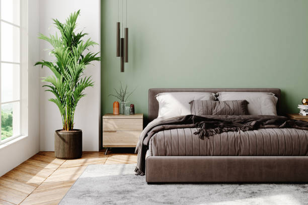 Modern bedroom with soft sage green walls and crisp white trims by a house painter in St. Pete Beach, FL