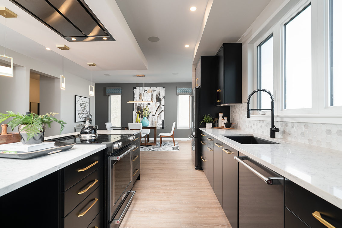 Modern kitchen with black painted cabinets and sleek trim by an interior painter in St. Petersburg, FL.